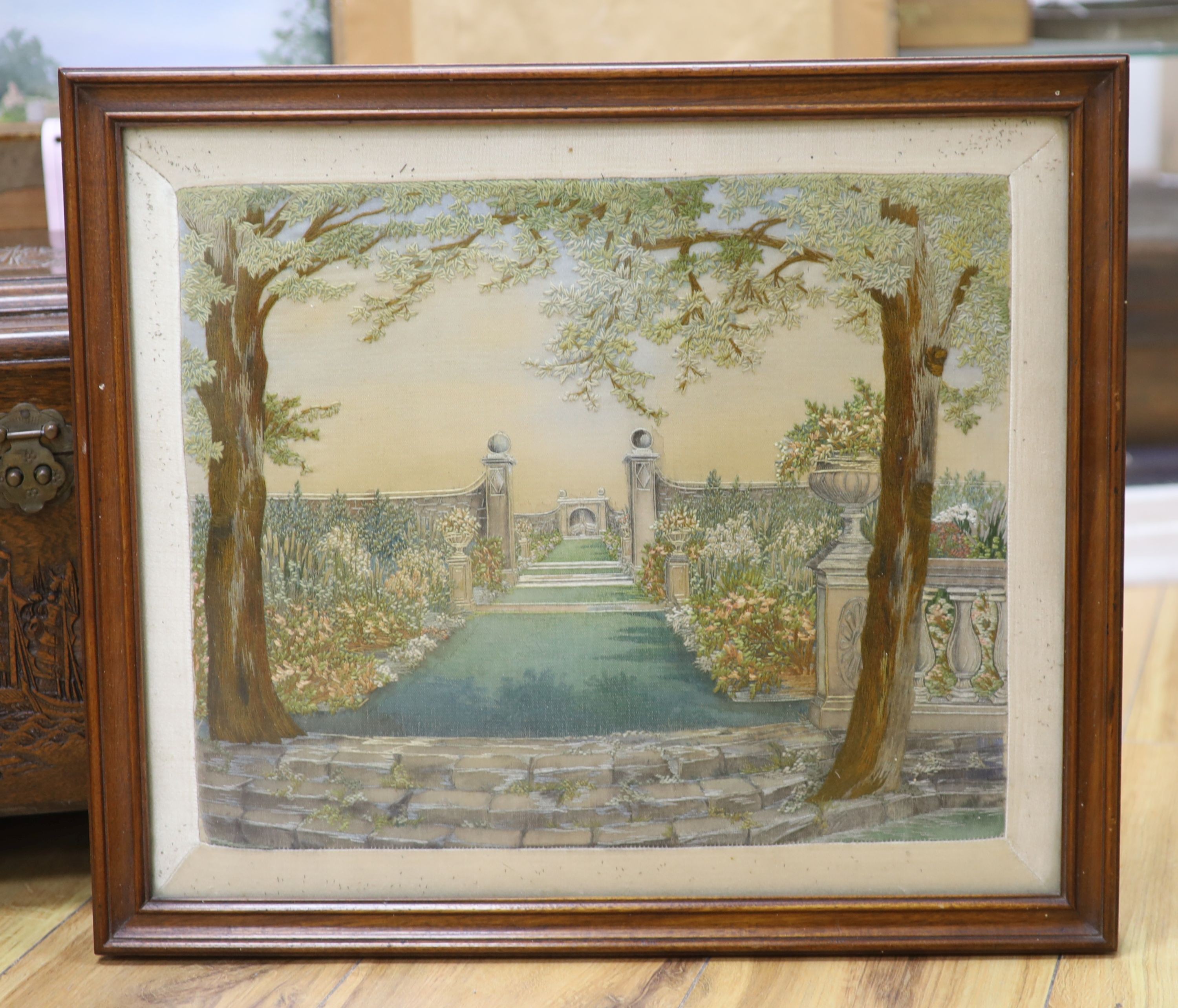 A 1920's-30's embroidered picture of a classical garden